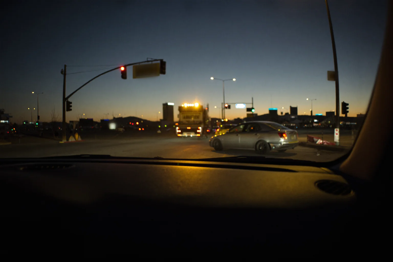 Las Vegas intersection at dusk after a car crash, illustrating Nevada bodily injury liability coverage