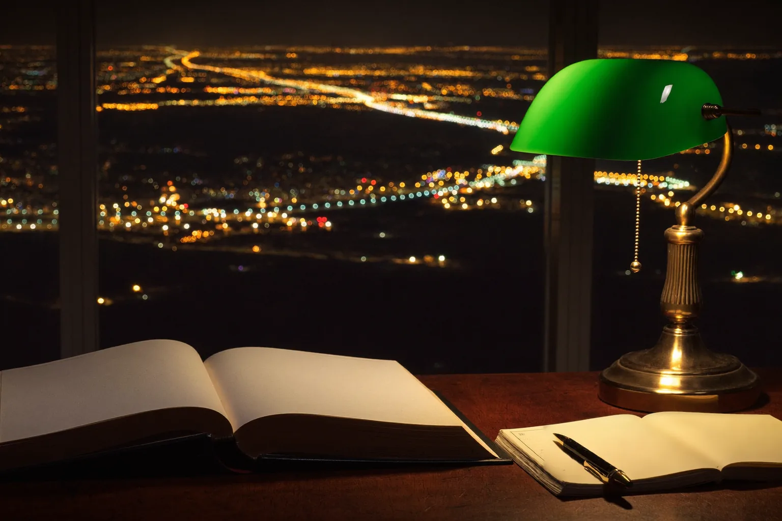 Open Nevada law book on a dark wood table under a brass lamp